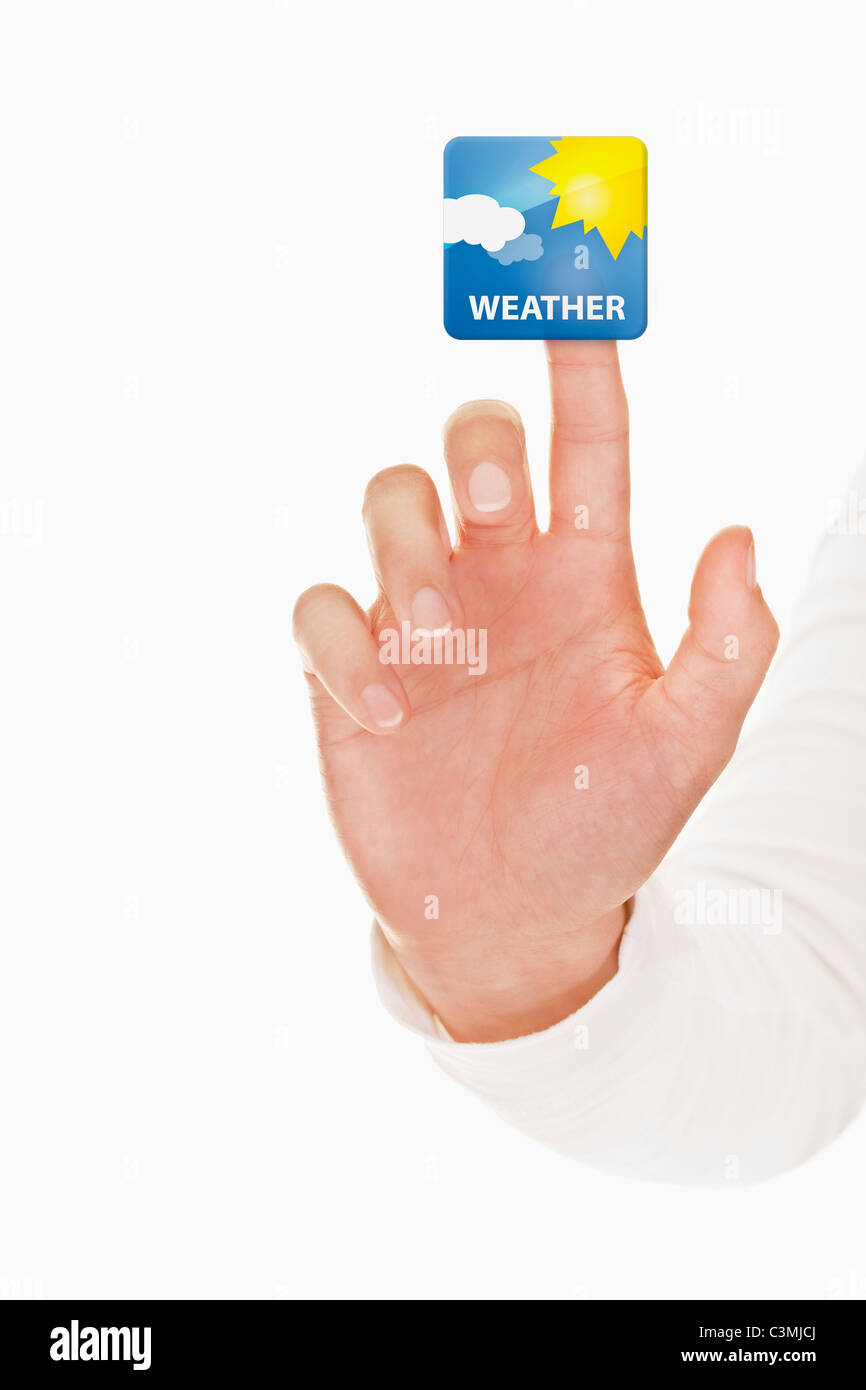 Mano umana toccando icona meteo Foto Stock