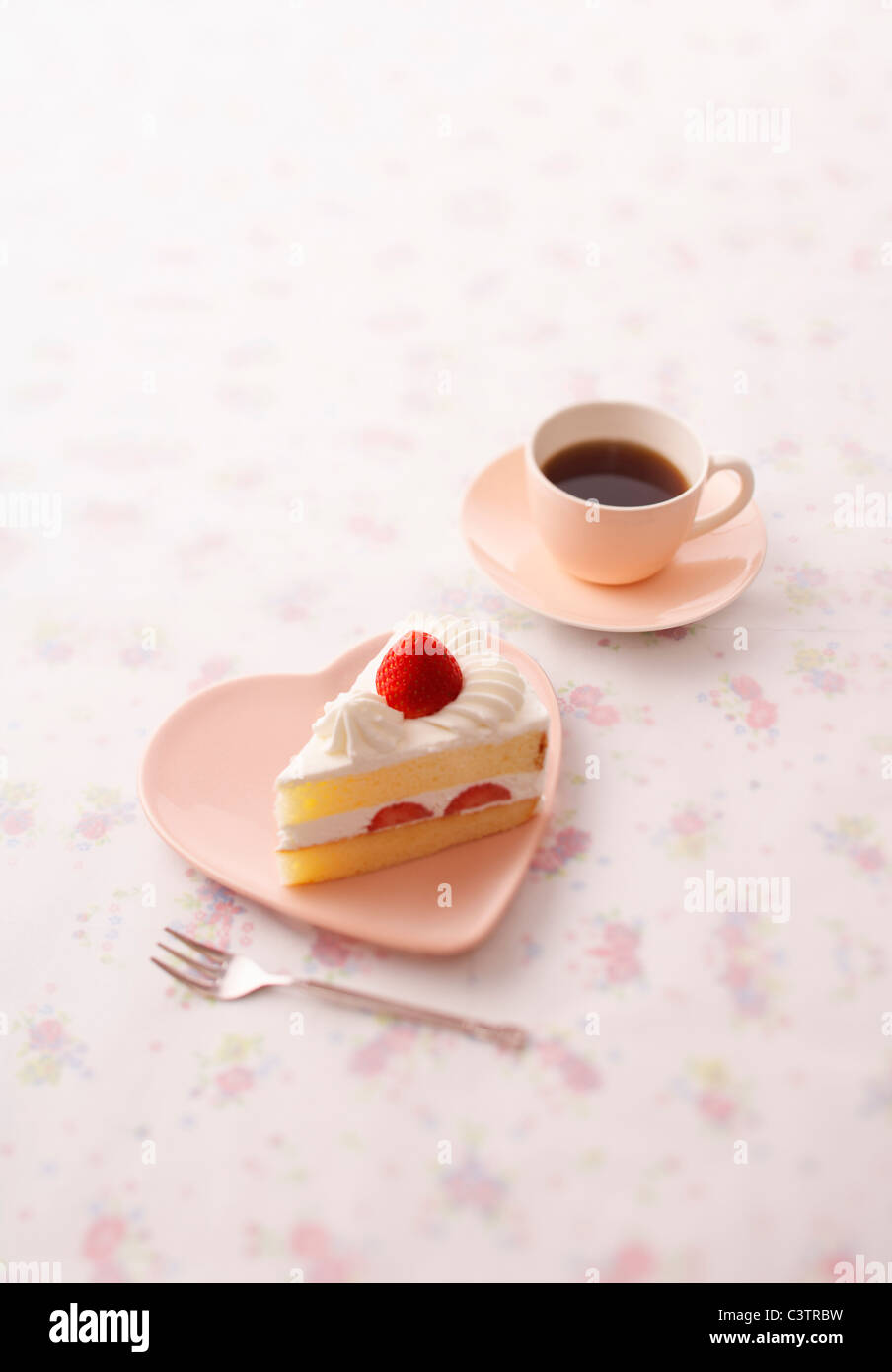 Il caffè e il pezzo di Shortcake Foto Stock