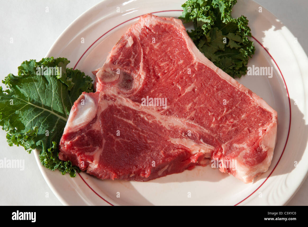 Materie T-bone steak su un piatto USA Foto Stock