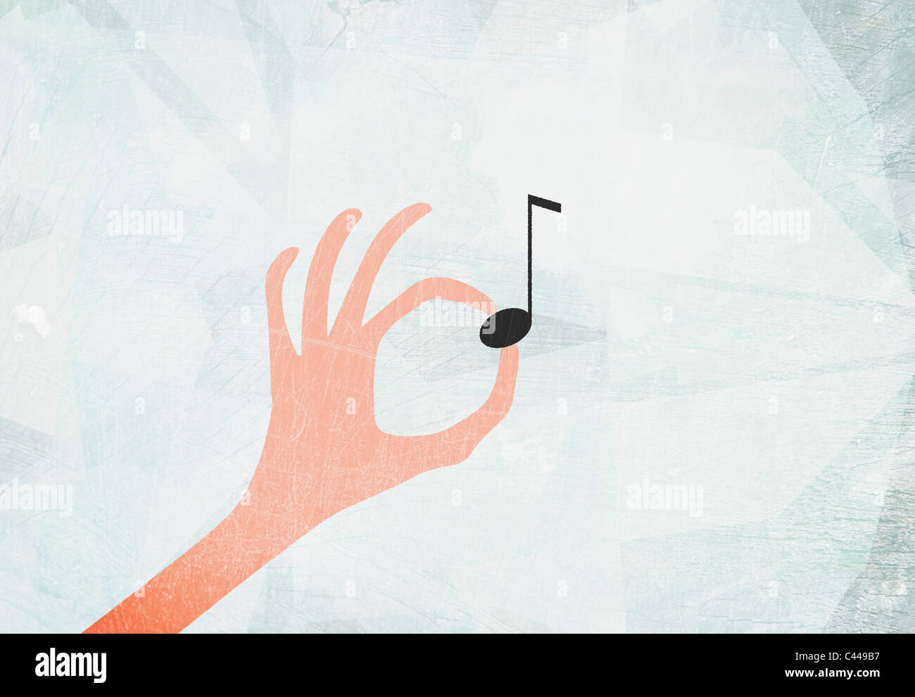 Una mano che tiene una nota musicale Foto Stock