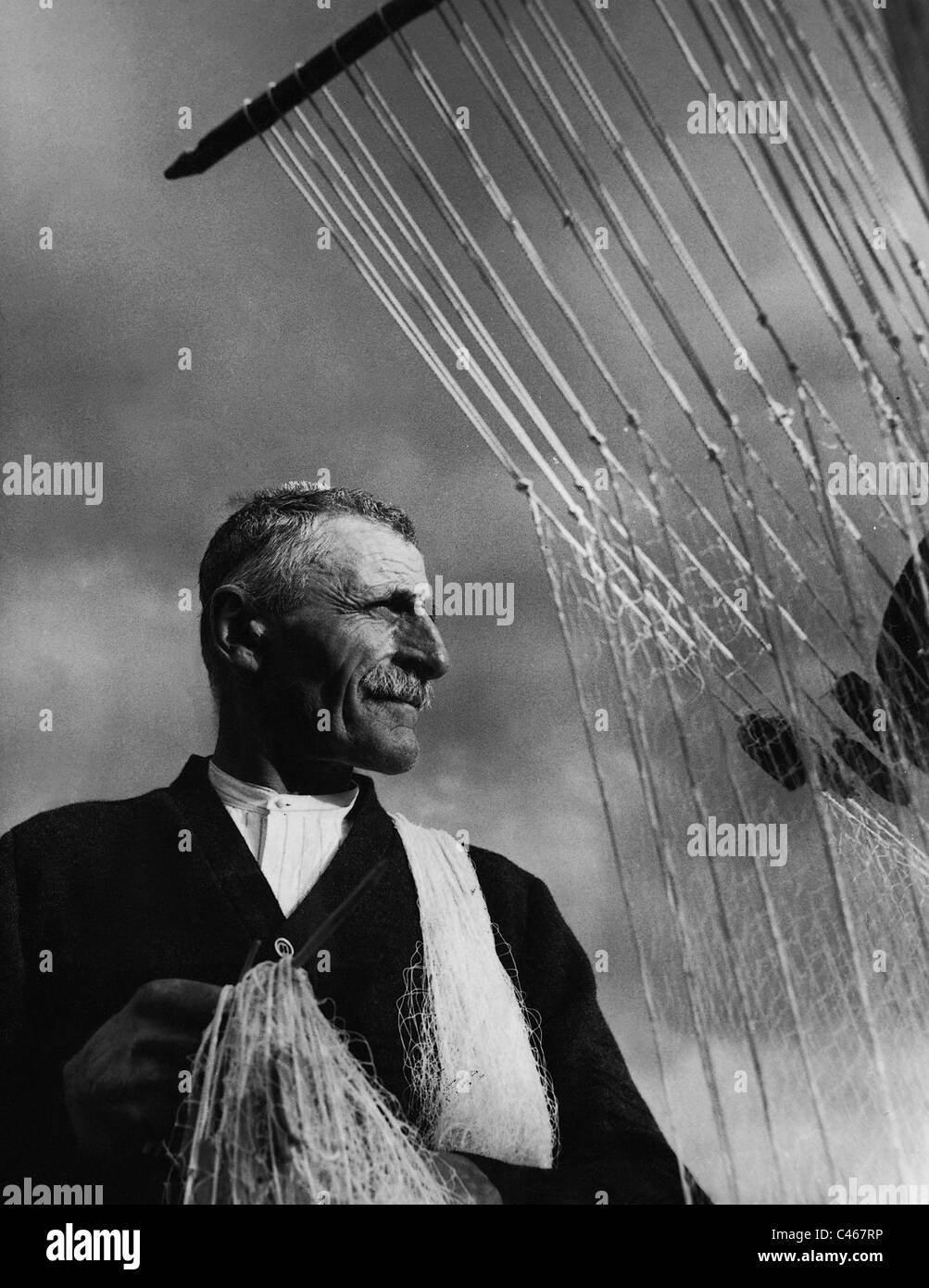 Fishman con net, 1939 Foto Stock
