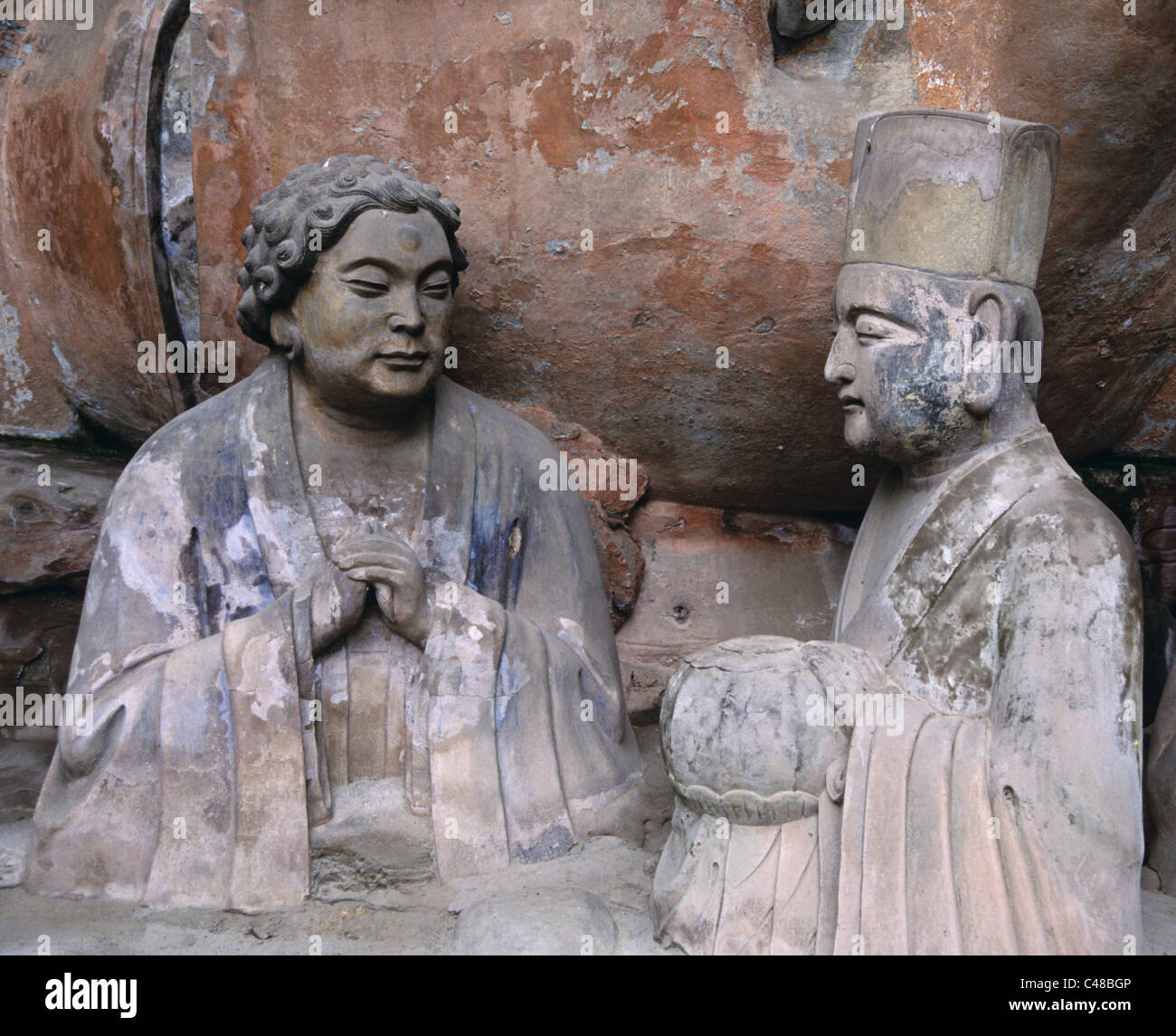 Curly intitolata figura con il Buddha sdraiato (1174-1252 AD), Baodingshan, Dazu, Cina 990603 1719 Foto Stock
