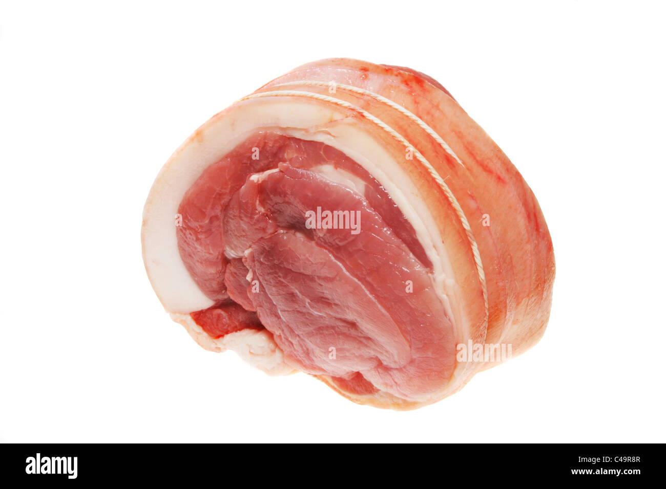 Carne di maiale cruda giunto isolato su uno sfondo bianco Foto Stock