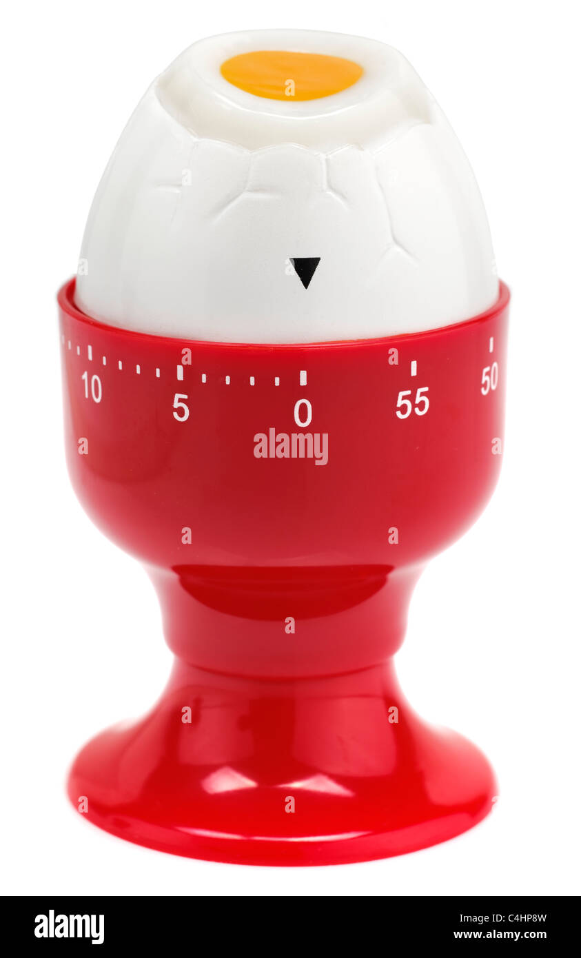 Timer di uovo a forma di un uovo in un eggcup rosso Foto Stock