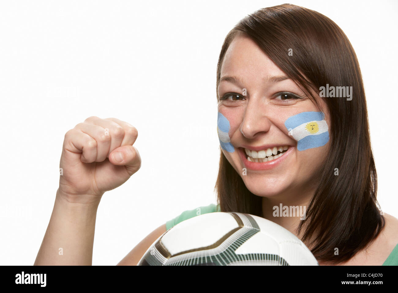 Femmina giovane tifoso di calcio con la bandiera argentina dipinta sul viso Foto Stock