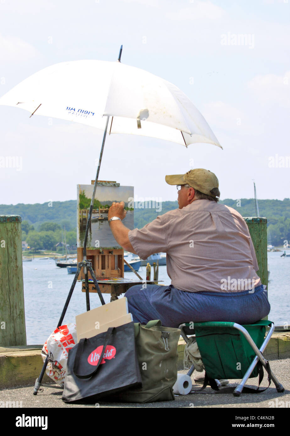 Plein Air artista pittura scena di Northport porto nel villaggio di Northport Long Island NY Foto Stock