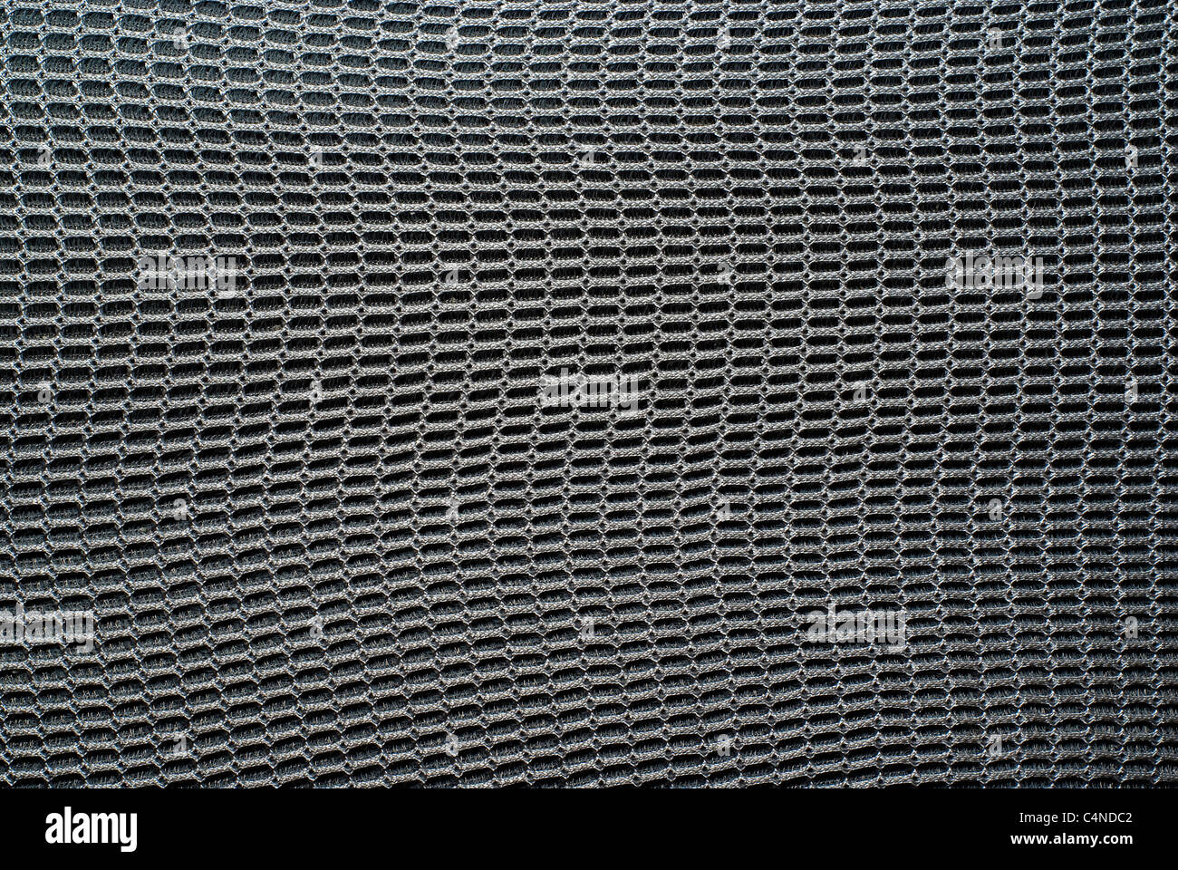 Close-up dettaglio di un acciaio-come tessuto texture di posta o di sfondo. Foto Stock