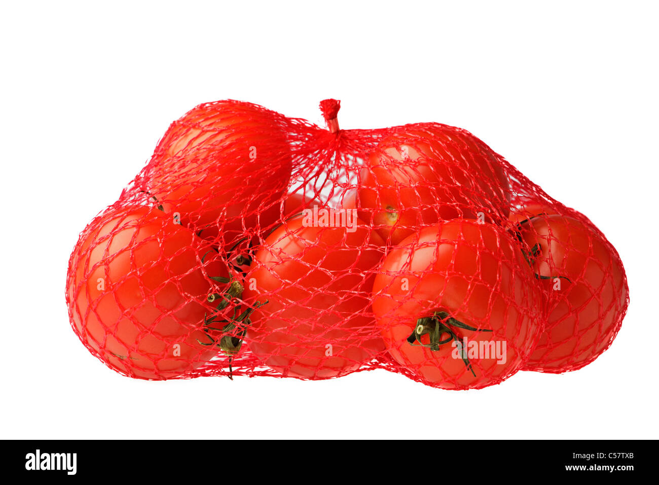 Sacchetto di pomodori maturi contro uno sfondo bianco Foto Stock