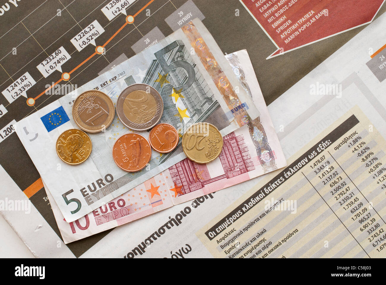 Finanziaria crisi,,Grecia,giornale,l'articolo,news,greci,monete,euro,greci le banconote in euro Foto Stock