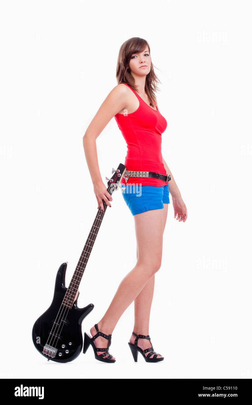 Giovani femmine bassista nella parte superiore rossa - isolato su bianco Foto Stock