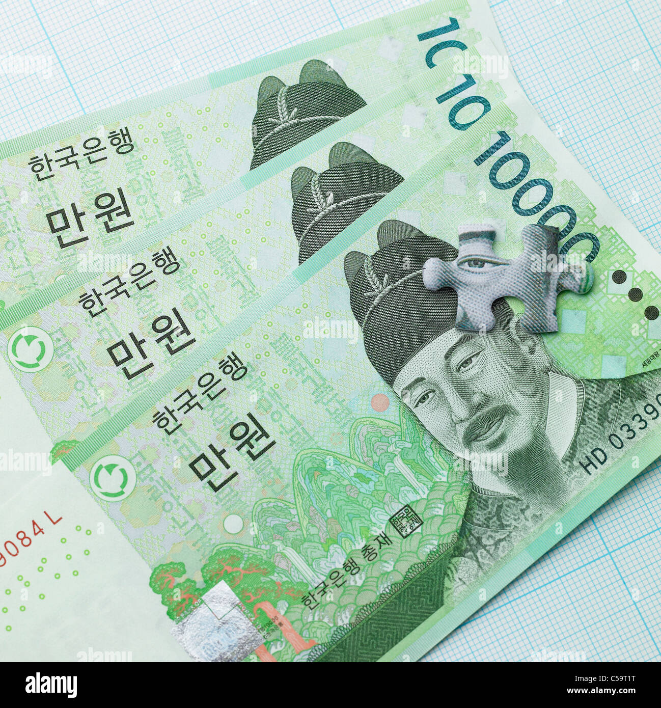 Close-up del pezzo del puzzle sulla valuta coreana Foto Stock