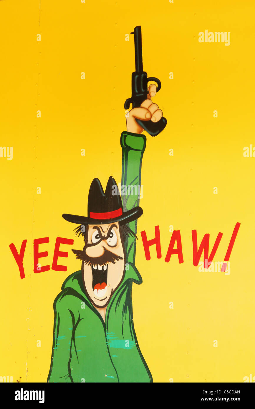 Yee haw! Cartoon l uomo con la pistola. Dipinto sul carnevale di attrazione. Foto Stock