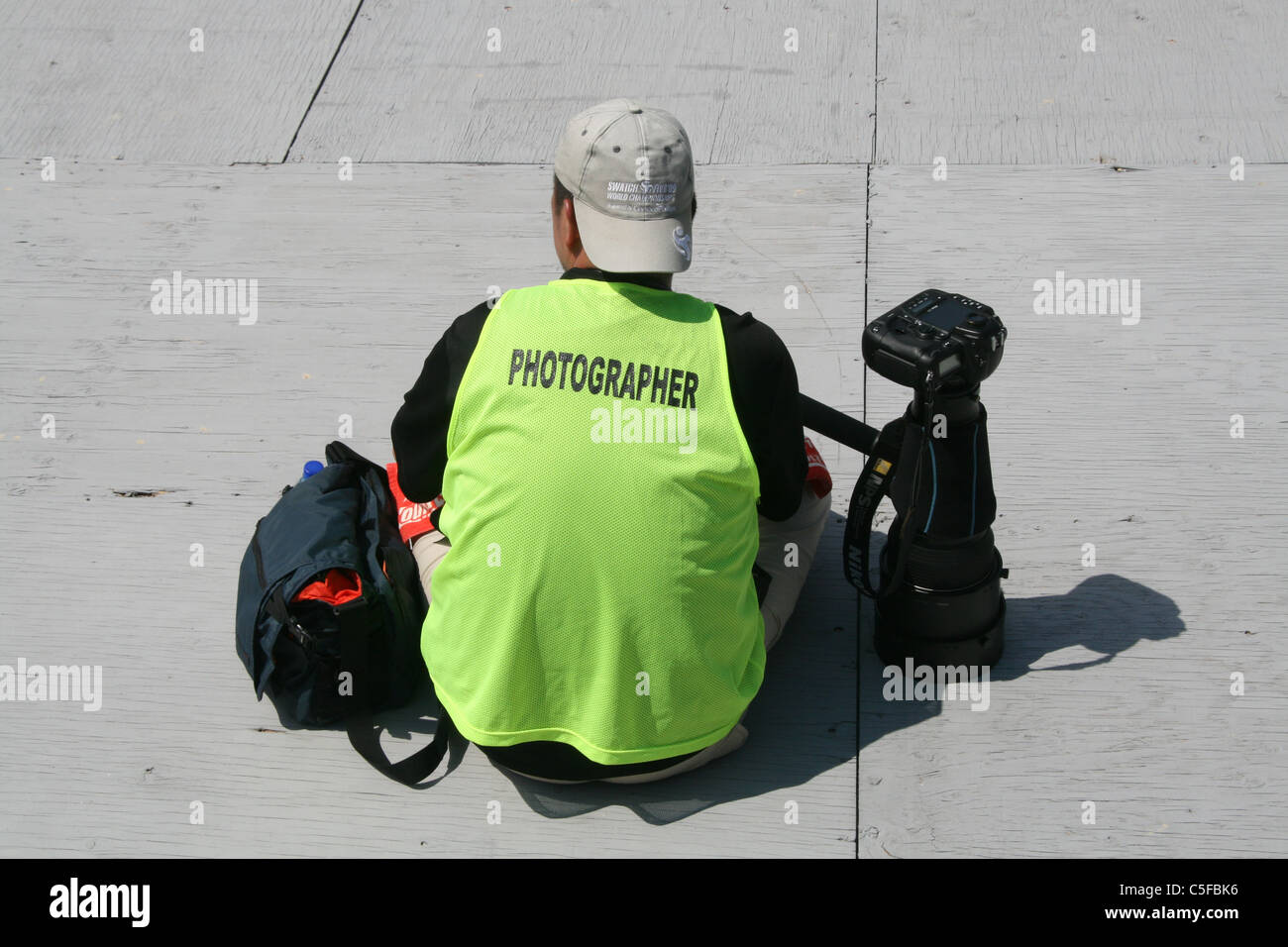 Fotografo con lente lungo la fotocamera Foto Stock