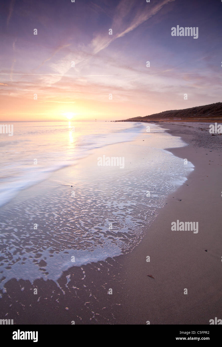 Waxham spiaggia al tramonto sulla costa di Norfolk Foto Stock