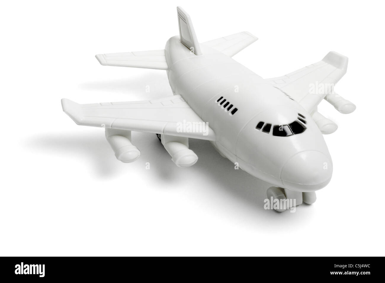 Giocattolo di plastica jet del passeggero aereo su sfondo bianco Foto Stock