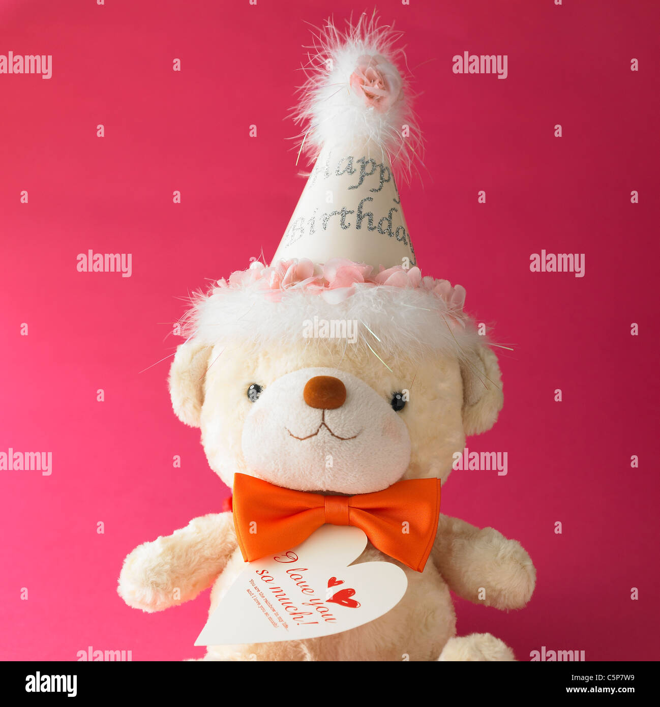 Un orsetto con party hat su Foto Stock