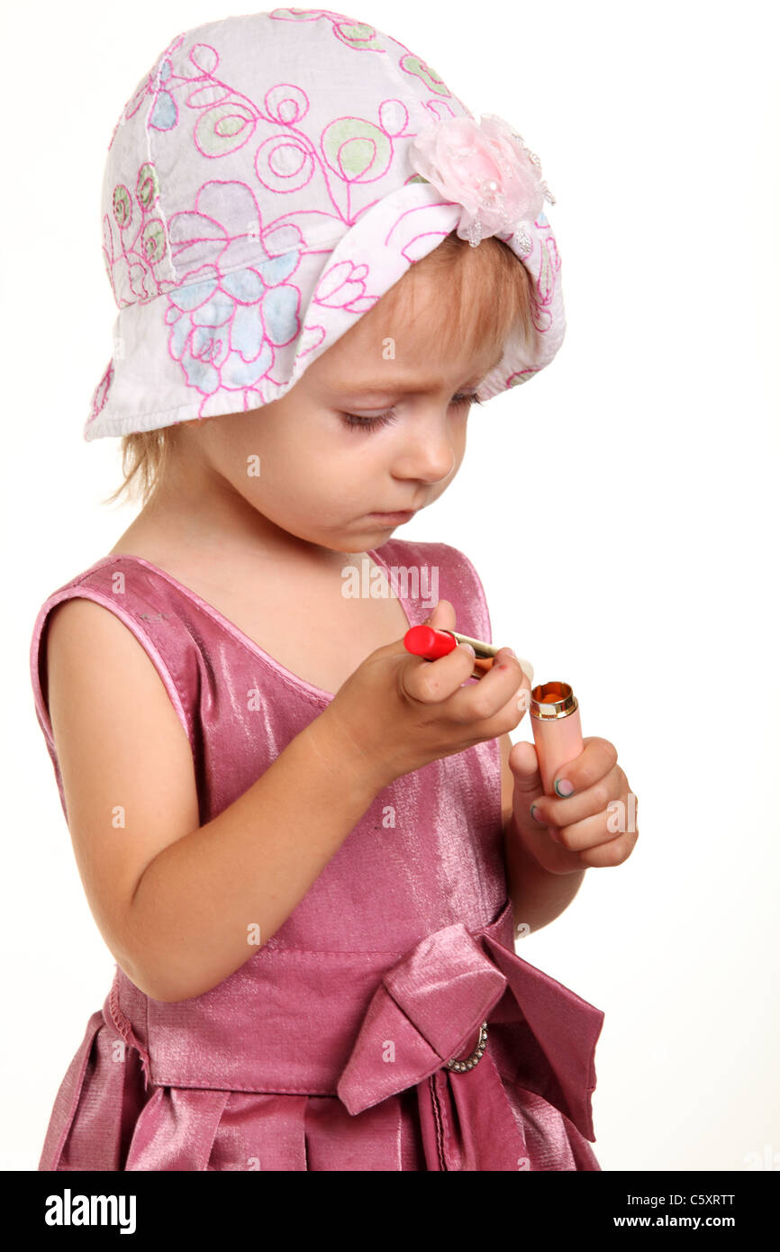 Bambina con rossetto rosso Foto stock - Alamy