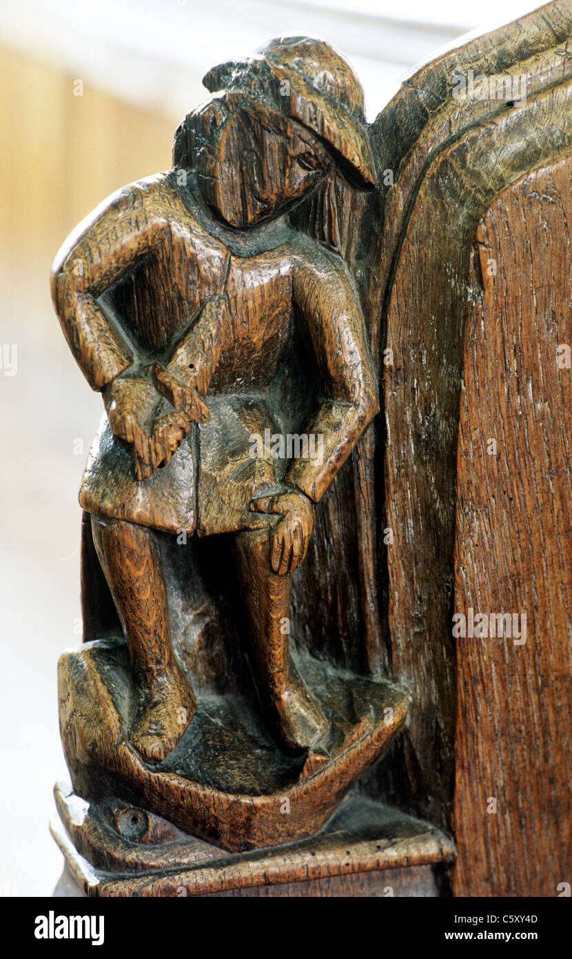 Thornham, Norfolk. Medievale banco fine, sette peccati capitali, ira, ganasce dell'Inferno Inghilterra Inglese Regno Unito di sculture in legno di incisioni Foto Stock