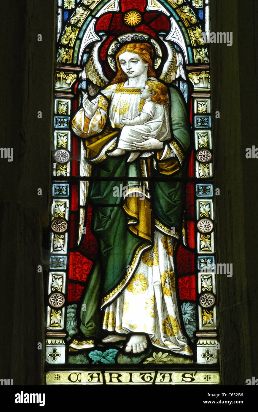 Vetrata raffigurante la Caritas (carità) San Michele e Tutti gli Angeli chiesa Edvin Ralph Herefordshire Inghilterra Foto Stock