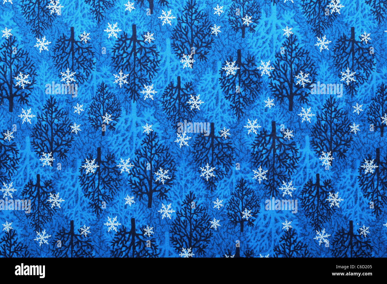 Tessuto blu sfondo con il simbolo del fiocco di neve e il modello ad albero. Foto Stock