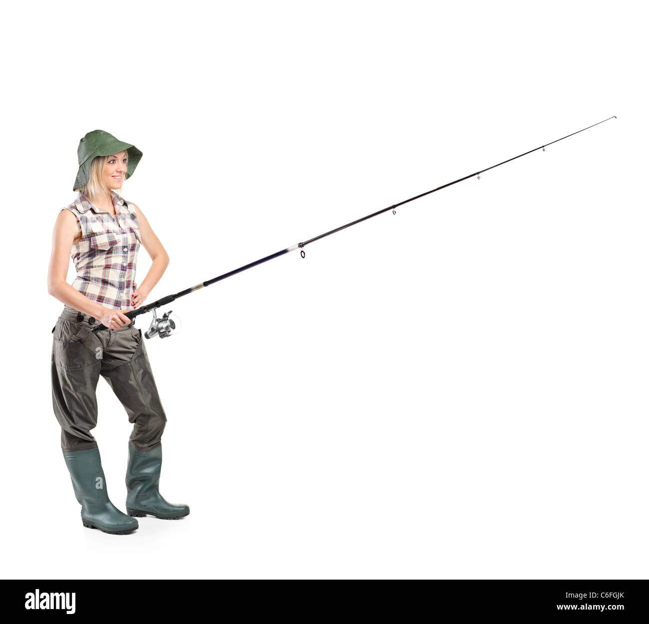 A piena lunghezza Ritratto di un sorridente fisherwoman tenendo una canna da pesca Foto Stock