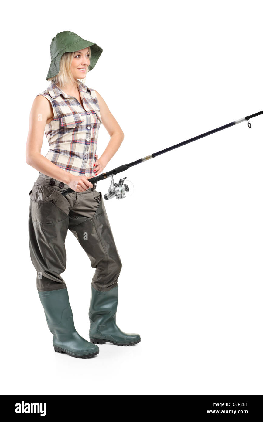 A piena lunghezza Ritratto di una donna in possesso di una canna da pesca Foto Stock