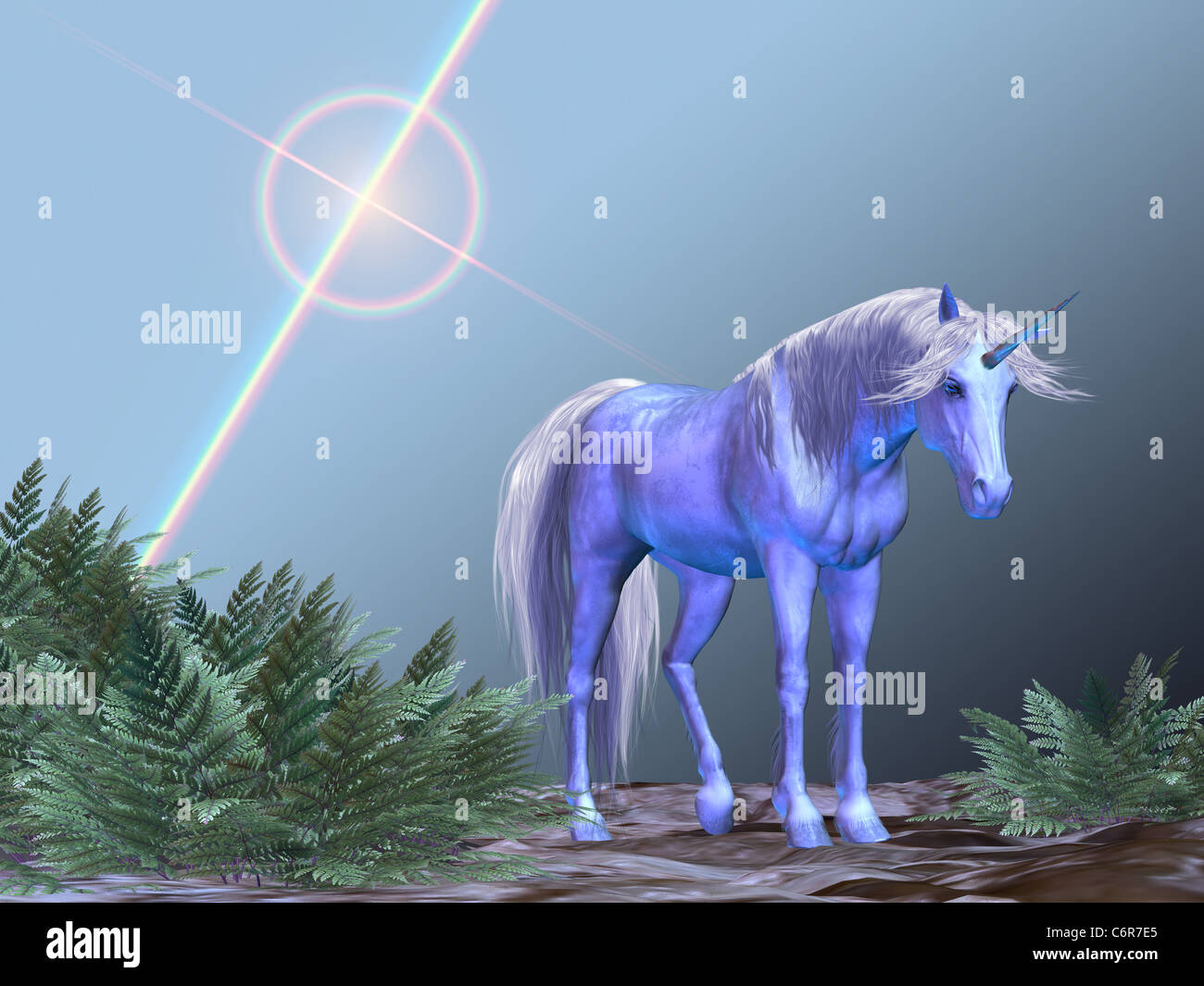 Un unicorno bianco appoggiata sotto una stella luminosa. Foto Stock