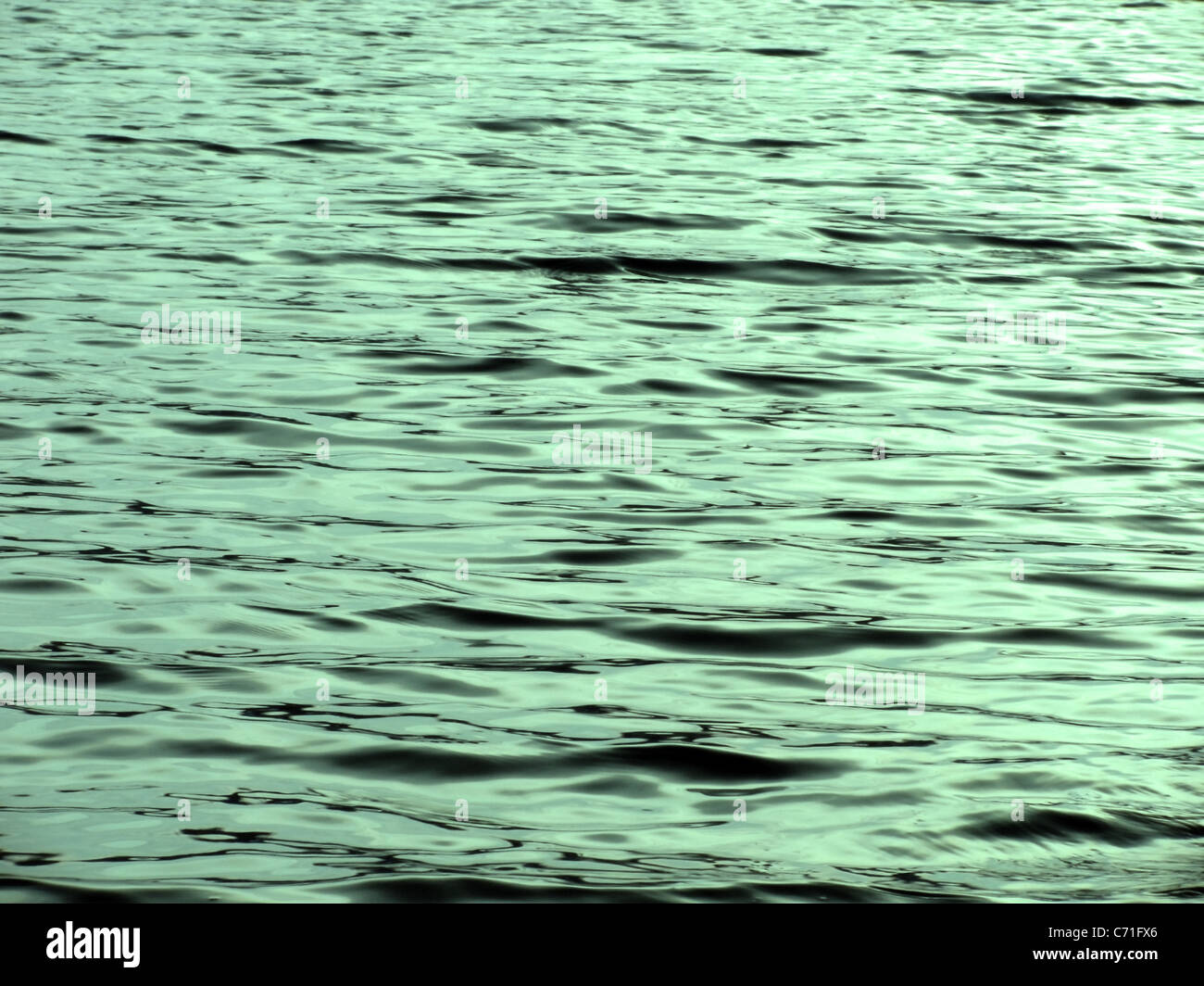 Abstract bacjground: acqua color smeraldo increspature Foto Stock