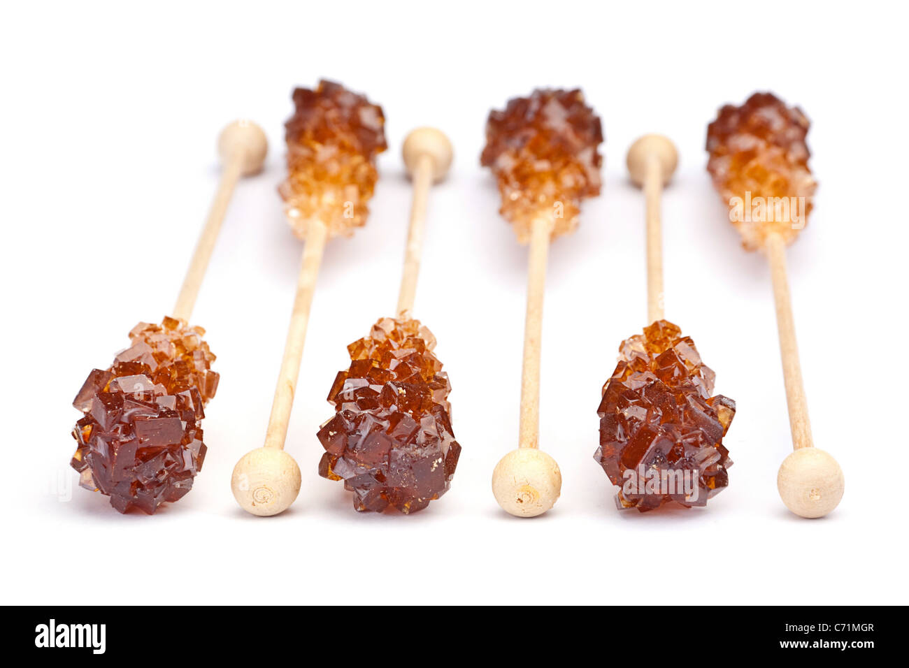 Brown ambra cristallo di zucchero sul bastone di legno Foto Stock