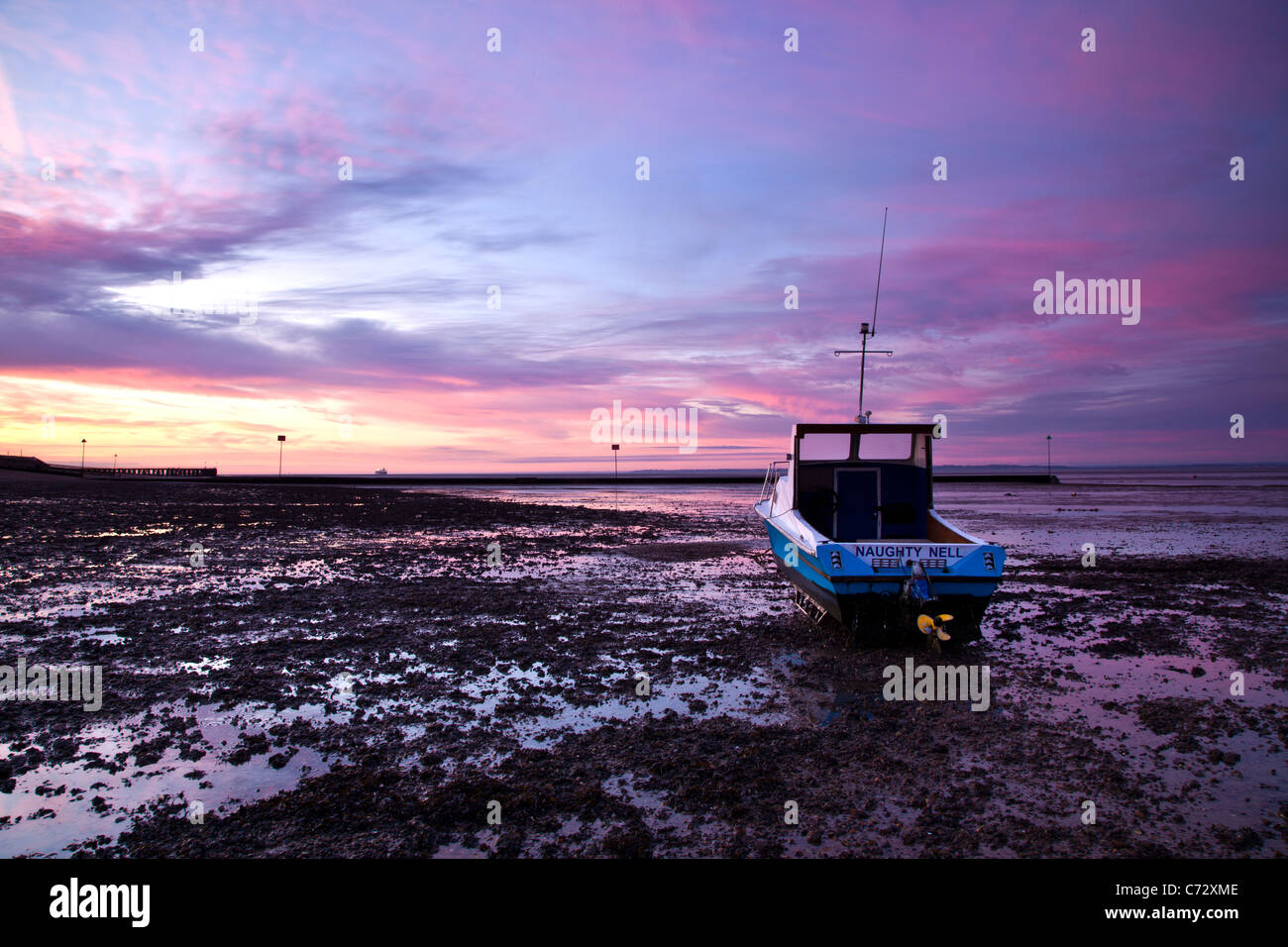 Lo spuntar del giorno con la bassa marea, Shoebury spiaggia comune Foto Stock