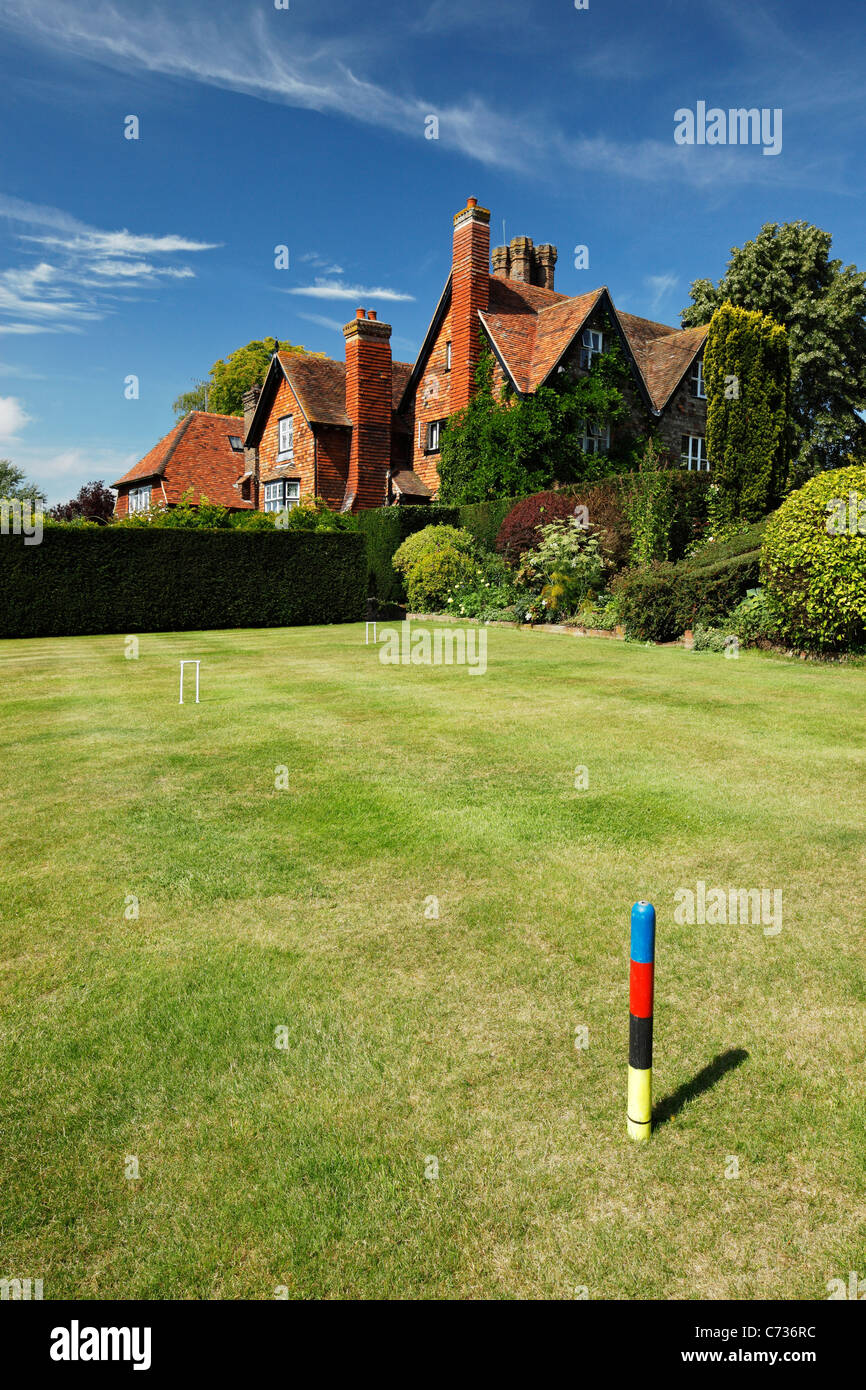 Campo da croquet nei giardini di una grande casa di campagna Kent. Foto Stock