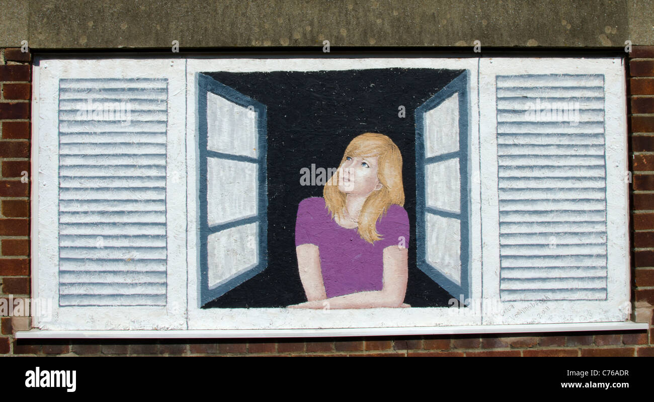 dipinto di una donna sul lato di un muro Foto Stock