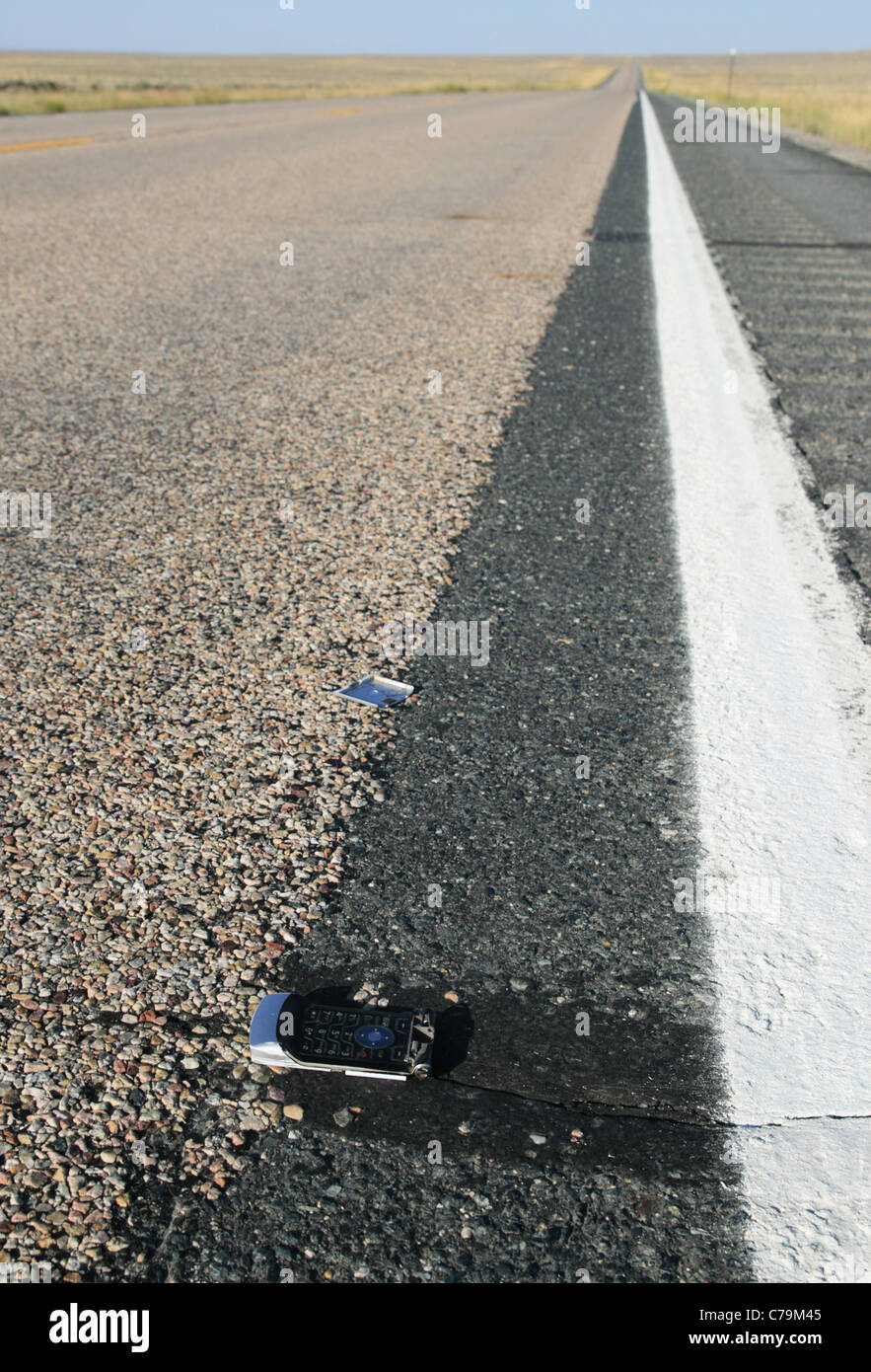 Rotture di correre su telefono cellulare sul lato strada Foto Stock