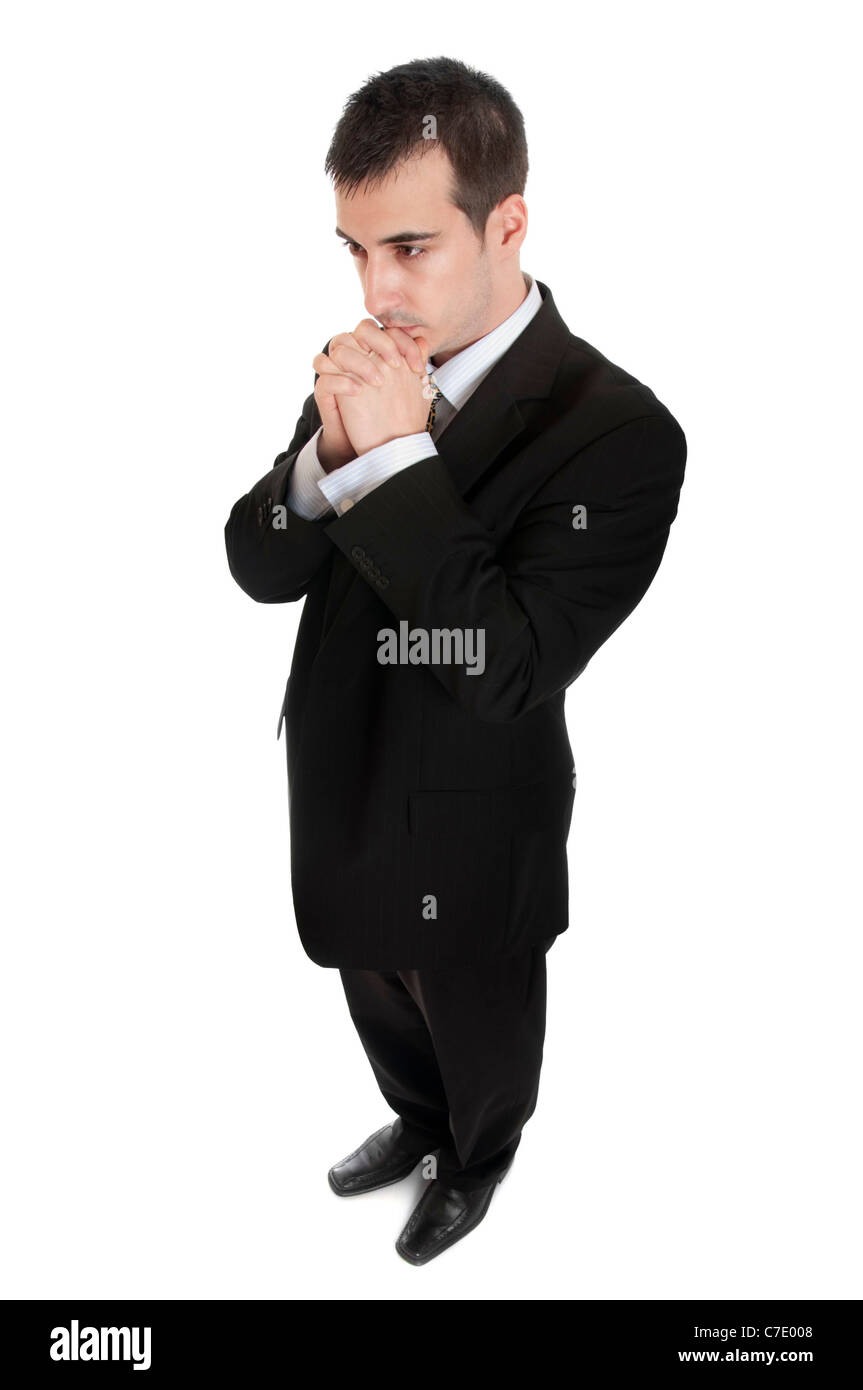 Isolato giovane uomo d affari pregare Foto Stock