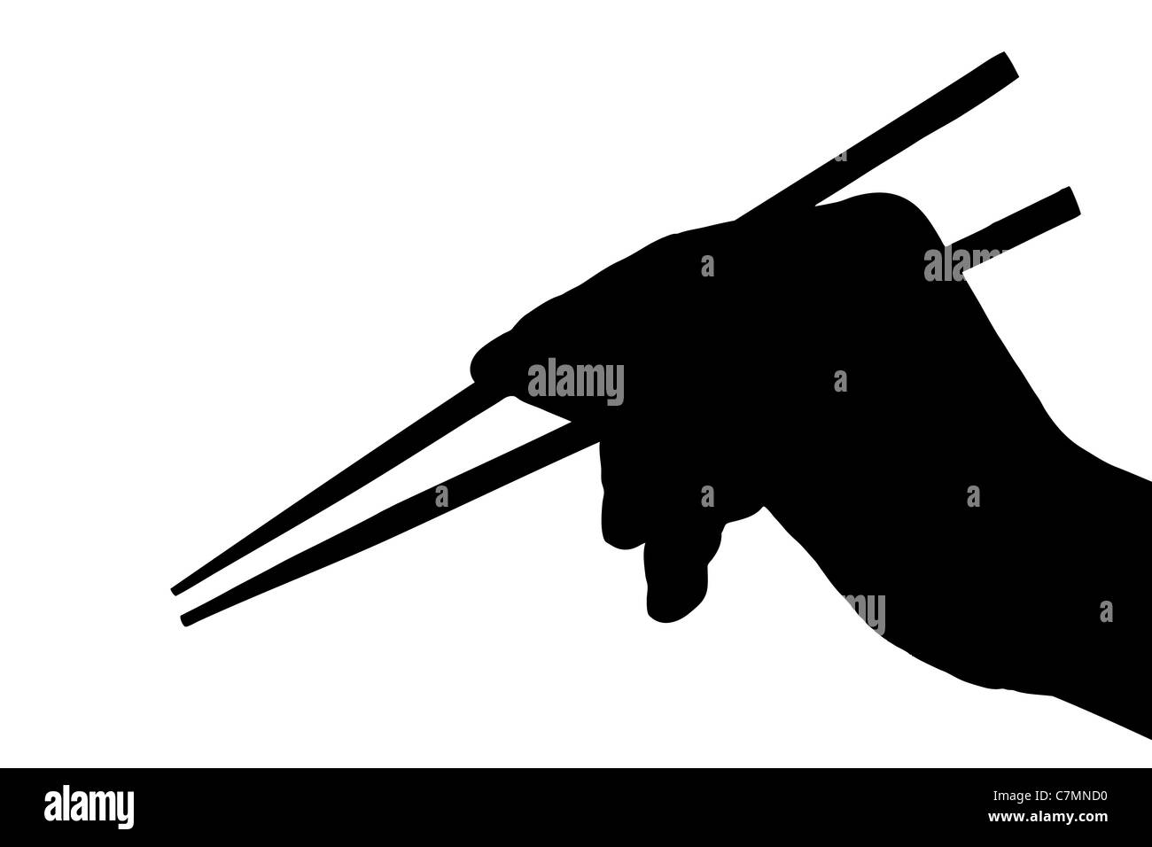 Silhouette di una mano che tiene le bacchette Foto Stock