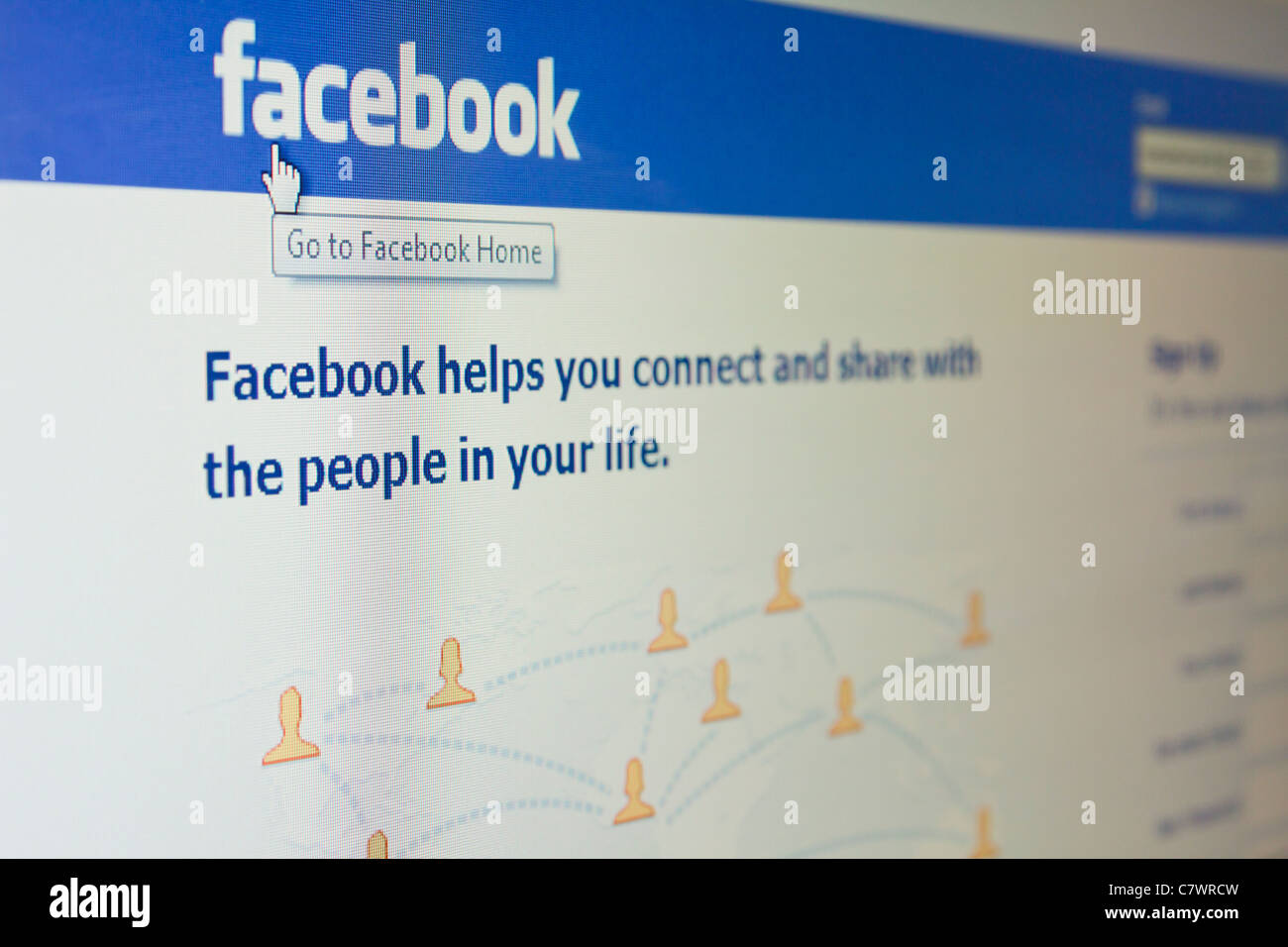 Facebook home page e cursore Mano sullo schermo Foto Stock