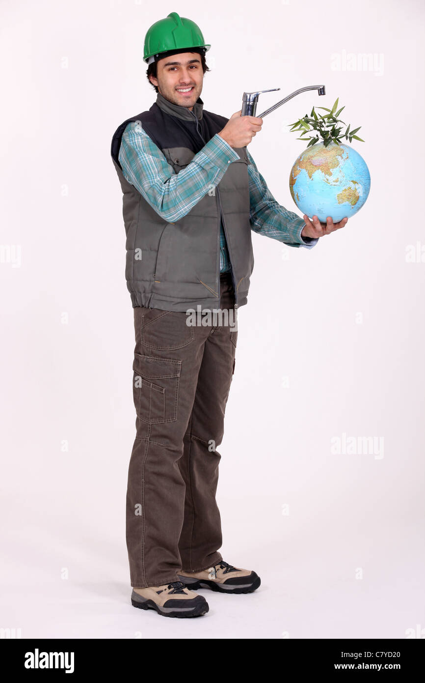 Plumber holding globe Foto Stock