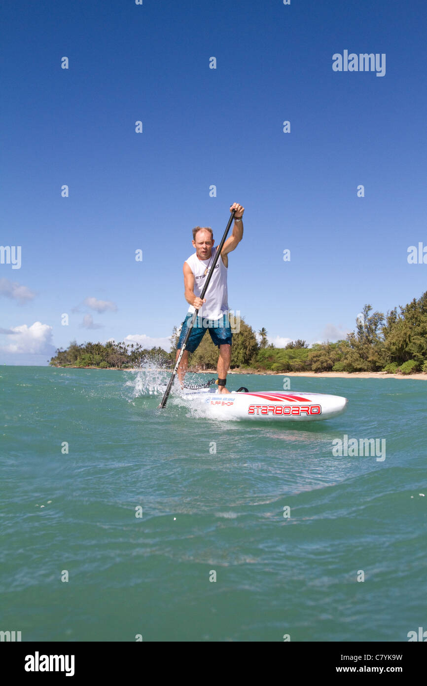 Pro stand up paddle board racer Foto Stock