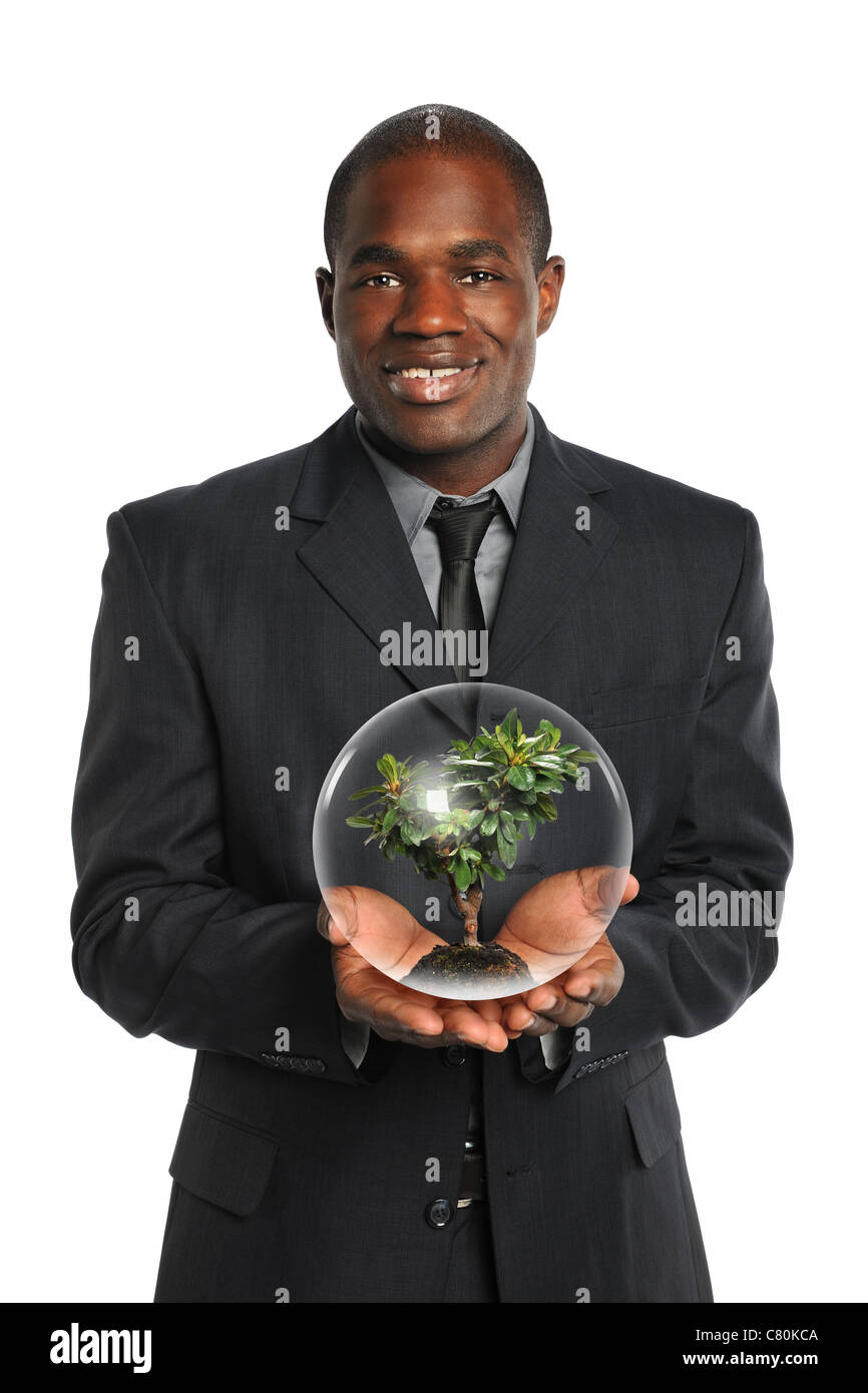 African American imprenditore struttura di contenimento all'interno della sfera di cristallo isolate su sfondo bianco Foto Stock