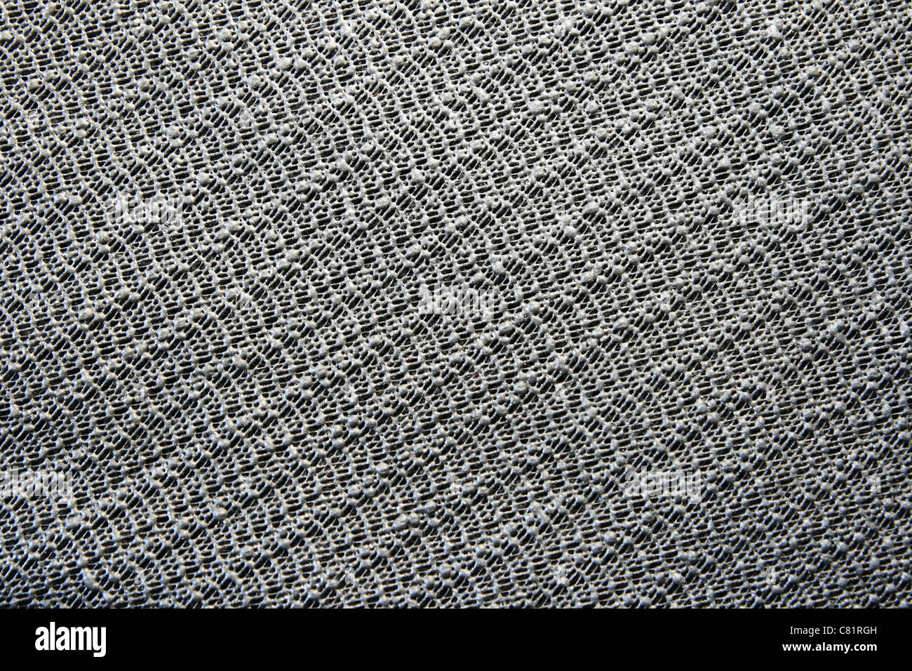Nero in gomma antiscivolo superficie appiccicosa pad texture di sfondo Foto Stock