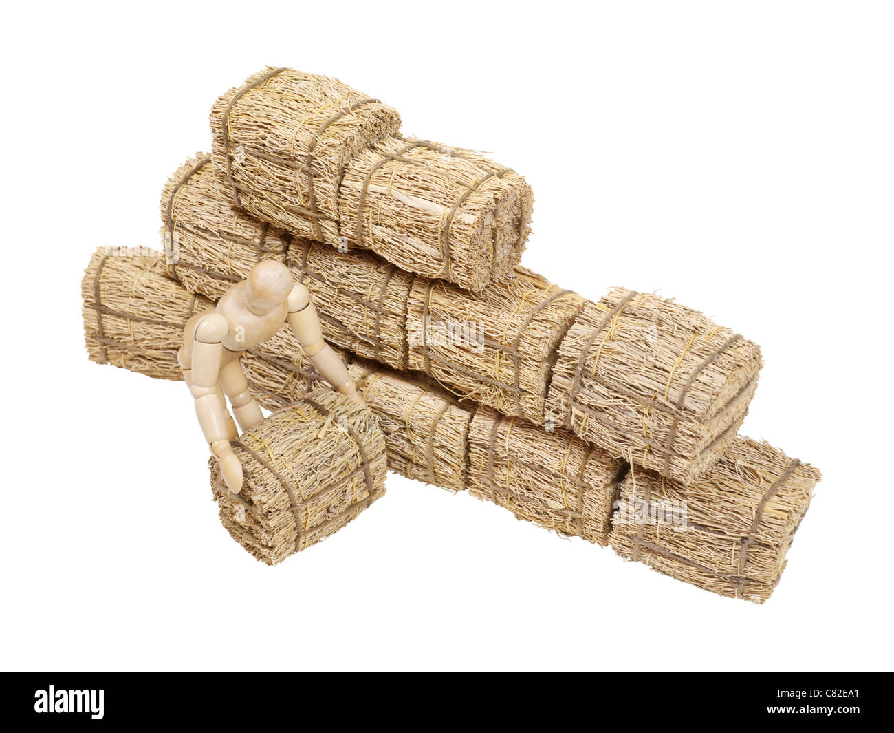 Il sollevamento di una balla di fieno utilizzato per la biancheria per il letto e per l'alimentazione di animali da allevamento - percorso incluso Foto Stock