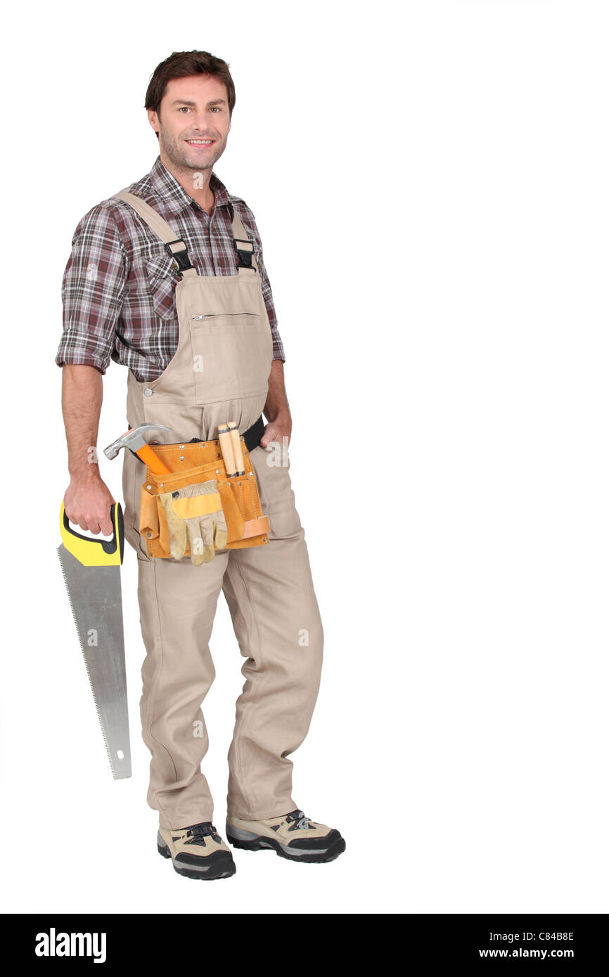 Builder con sega a mano. Foto Stock