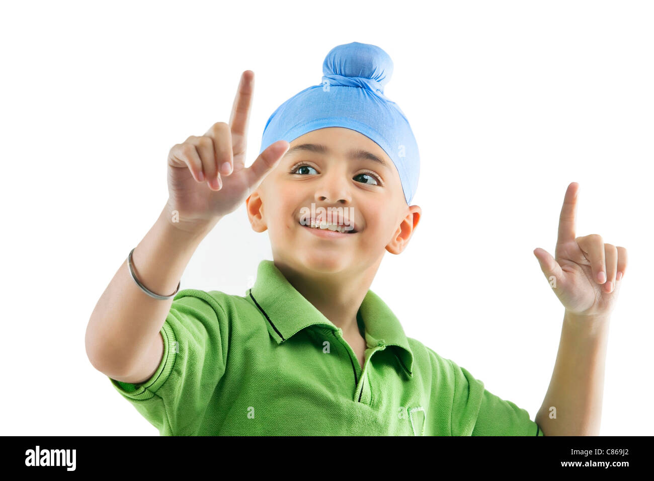 Un ragazzo Sikh dancing Foto Stock