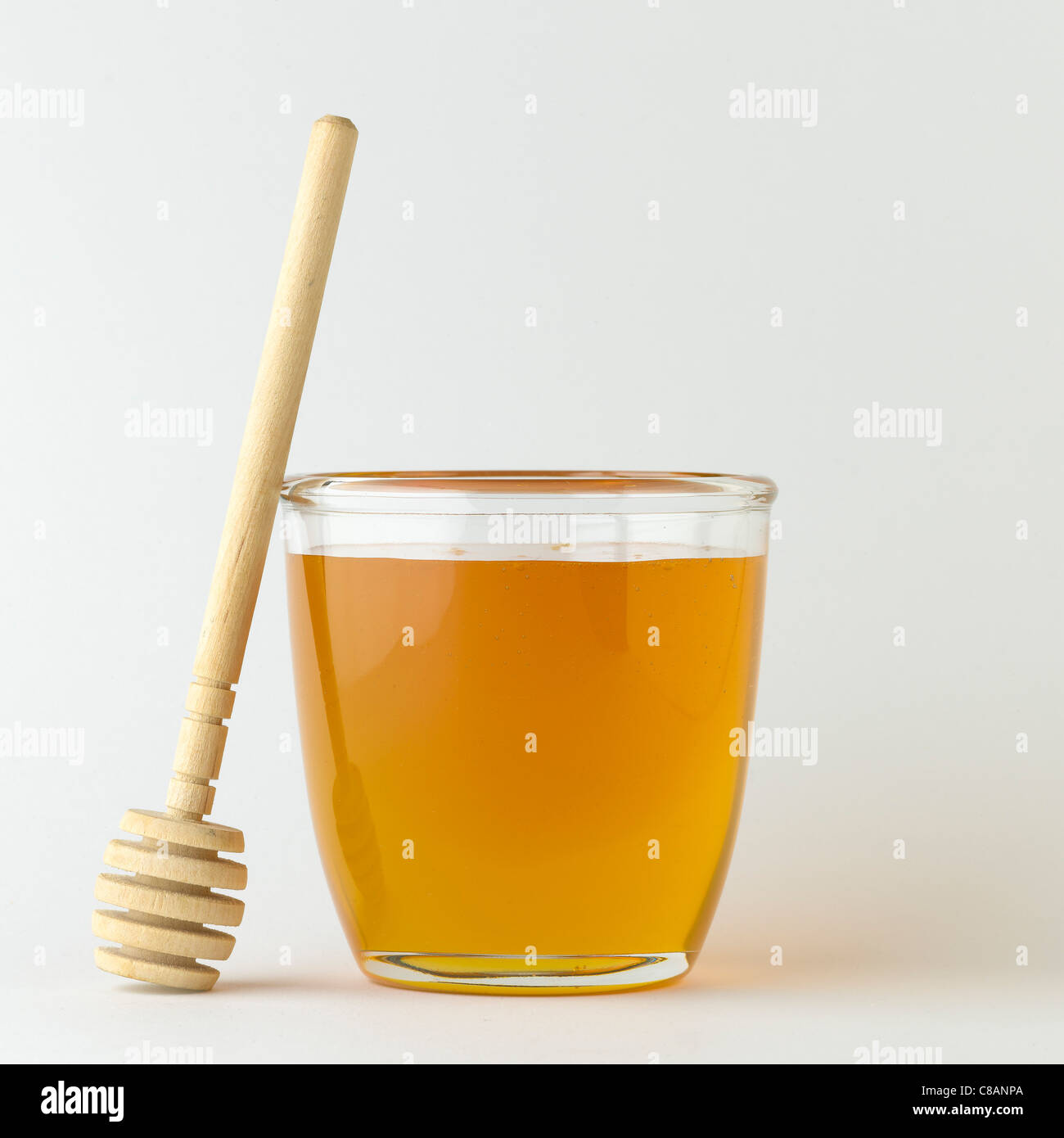 Vasetto di miele e di legno cucchiaio di miele Foto Stock