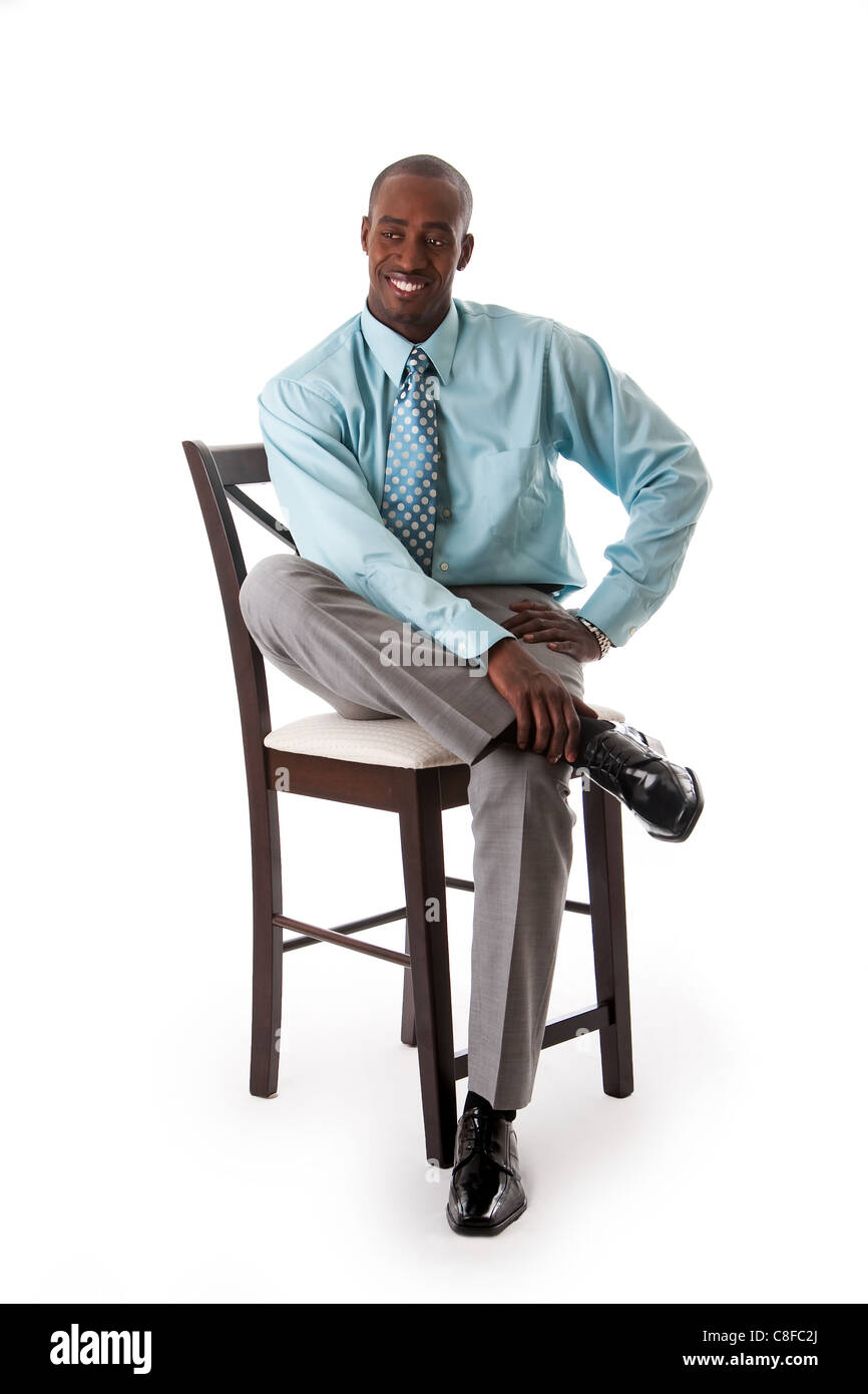 Uomo d'affari su una sedia Foto Stock