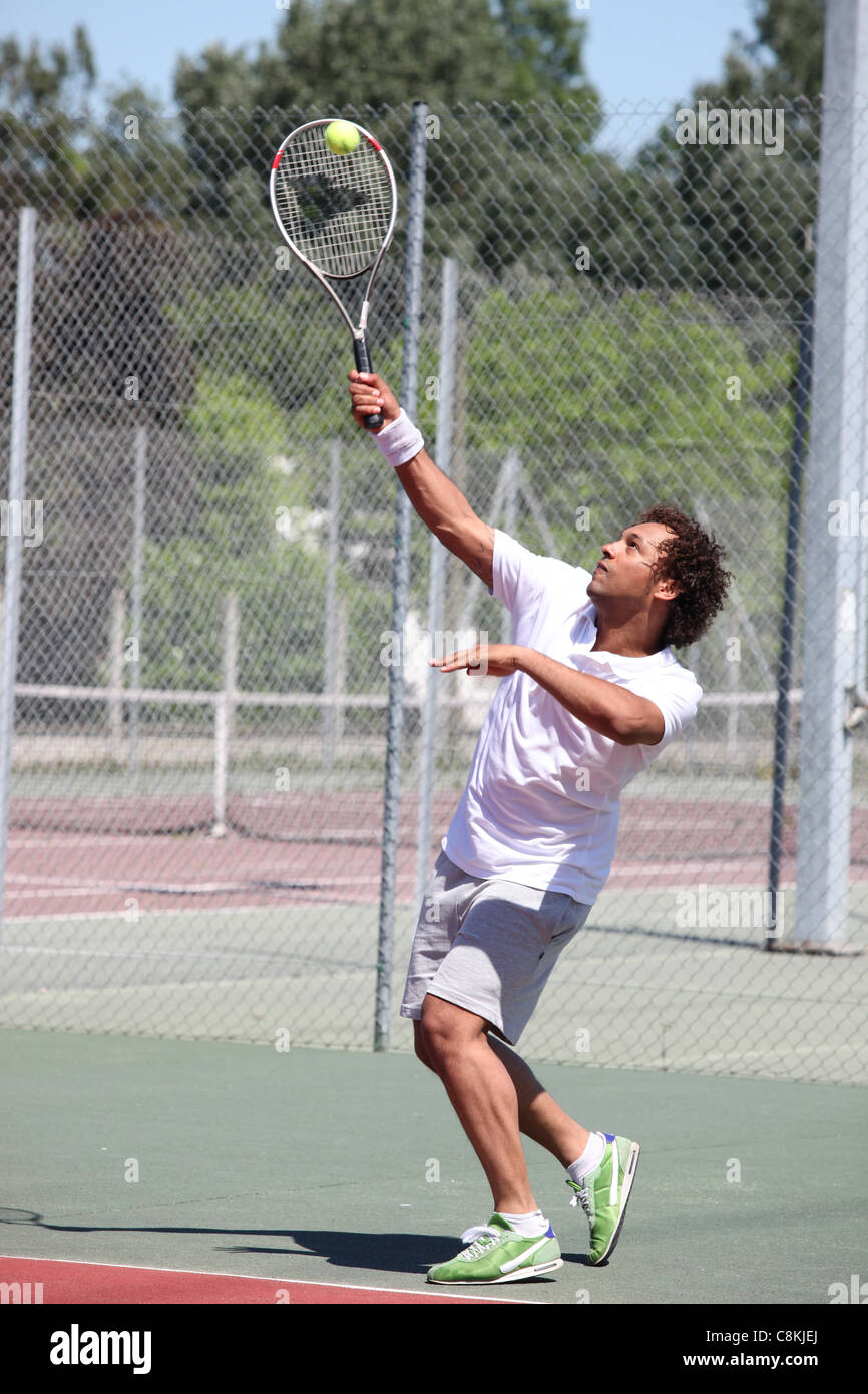 Giocatore di tennis in azione Foto Stock