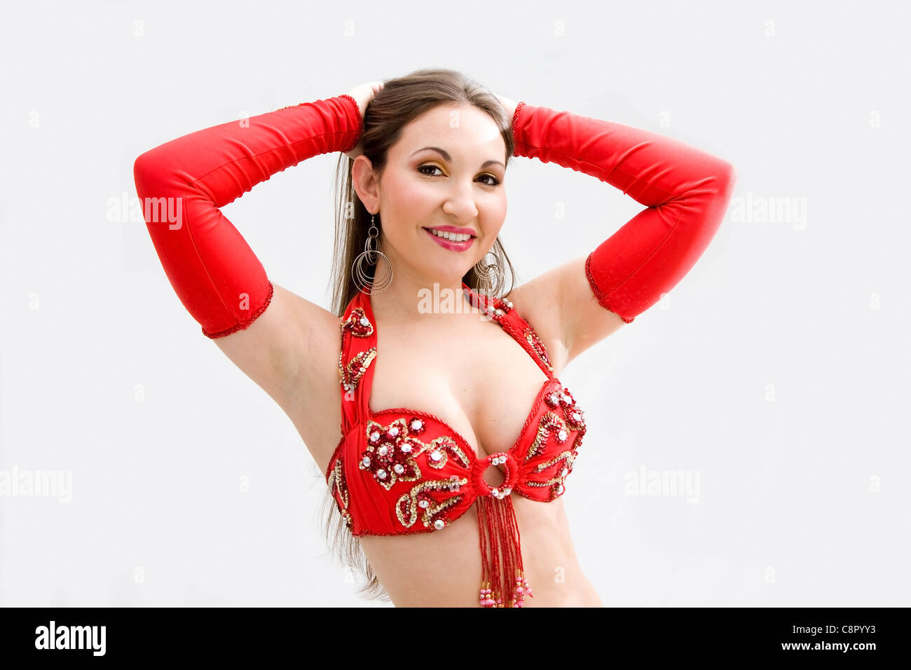 Una danzatrice del ventre in rosso Foto Stock