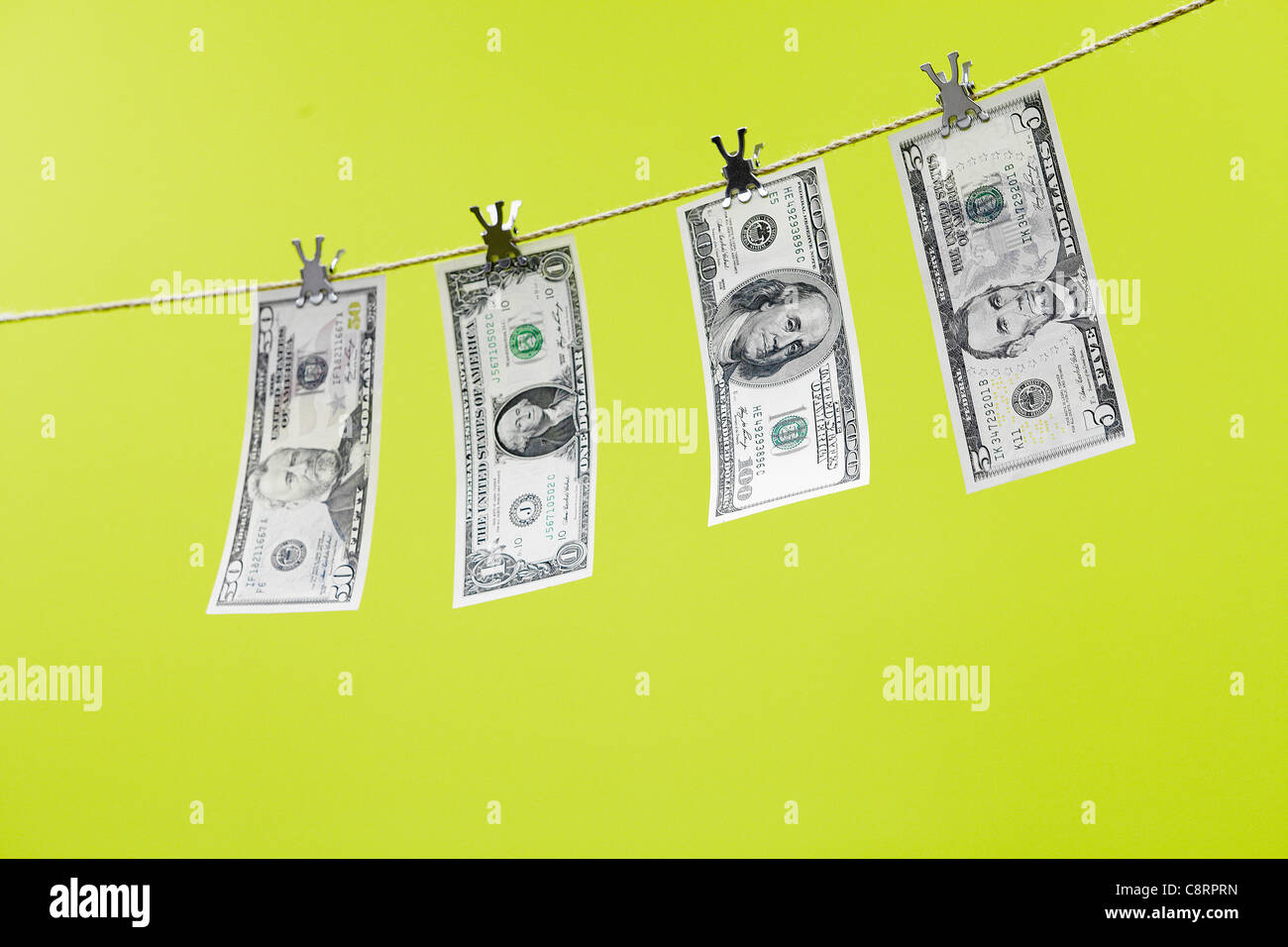 Soldi appesi stendibiancheria Foto Stock
