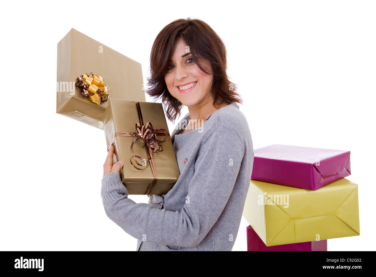 Shopping giovane donna con un sacco di scatole, su bianco Foto Stock