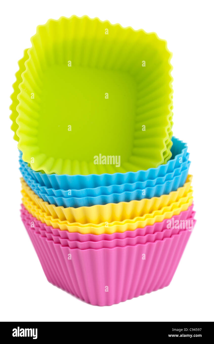 Pila di colori misti silicone cupcake casi dello stampo Foto Stock